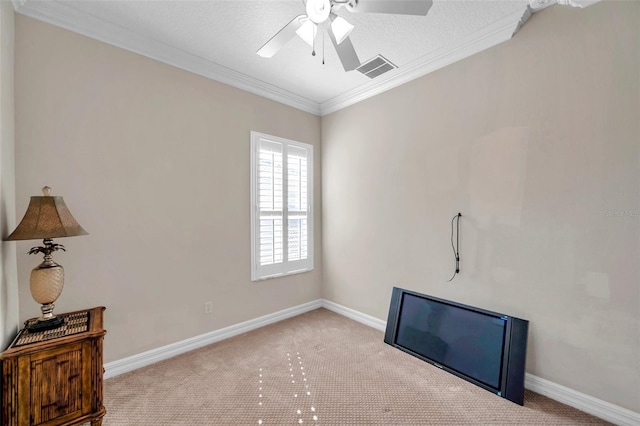 miscellaneous room featuring a textured ceiling, ceiling fan, ornamental molding, and light carpet