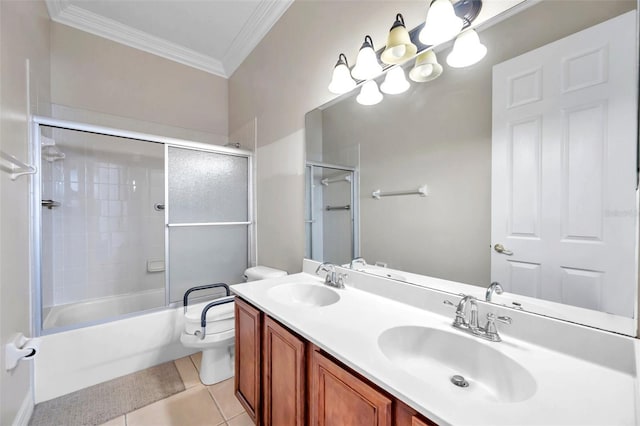 full bathroom with tile patterned floors, crown molding, toilet, vanity, and tiled shower / bath