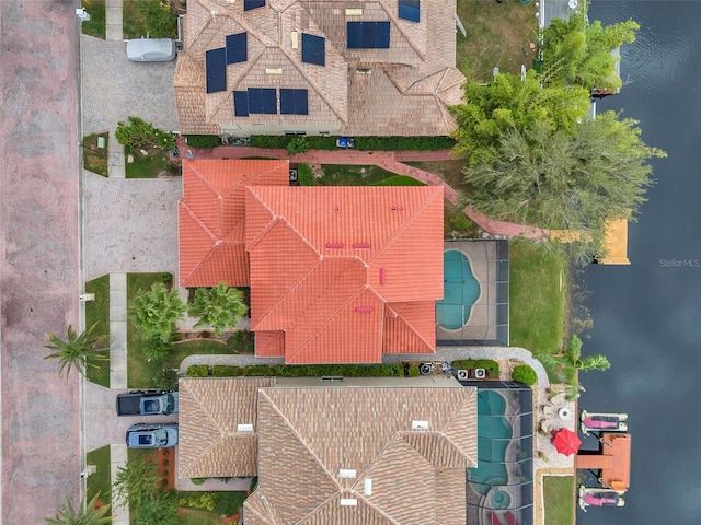 birds eye view of property with a water view