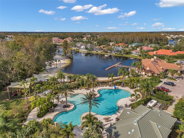 birds eye view of property with a water view