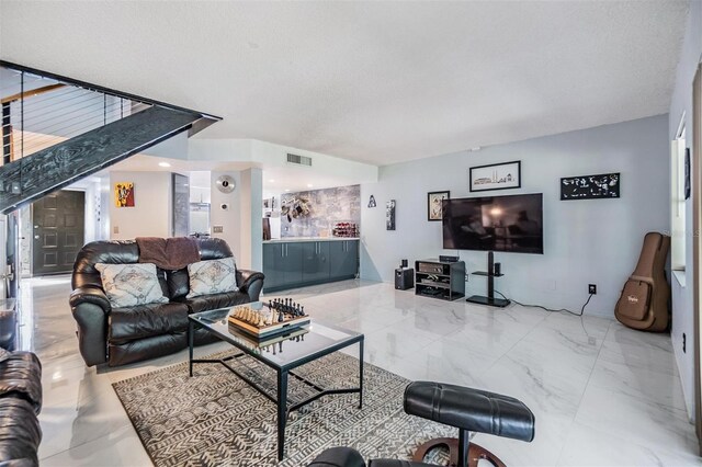 living room featuring a textured ceiling