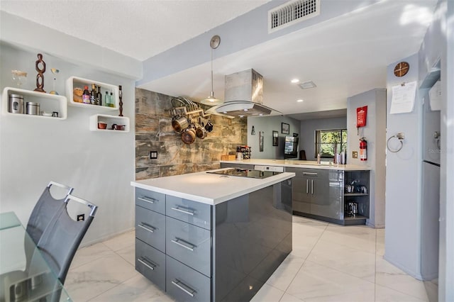 kitchen with a center island, hanging light fixtures, black electric cooktop, island range hood, and kitchen peninsula