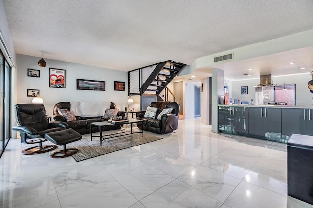 living room with a textured ceiling