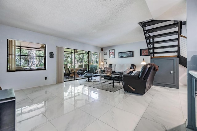 living room featuring a textured ceiling