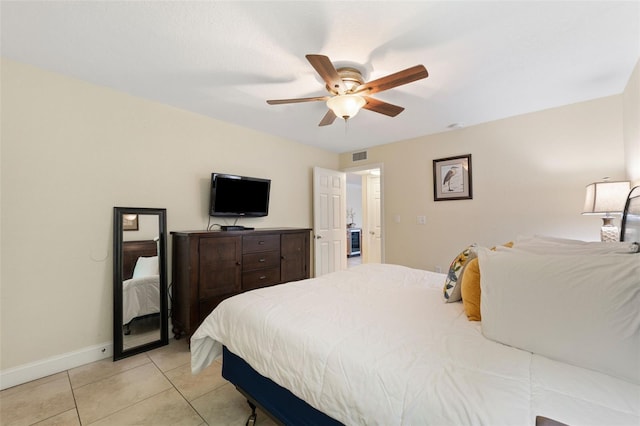 tiled bedroom with ceiling fan