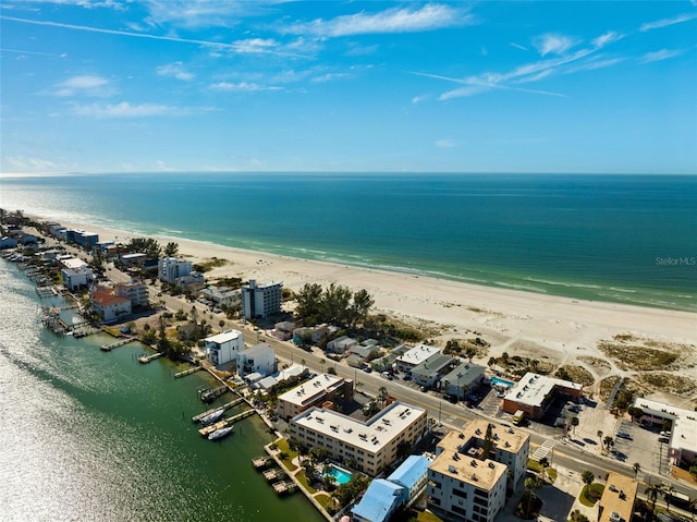 aerial view with a water view and a view of the beach