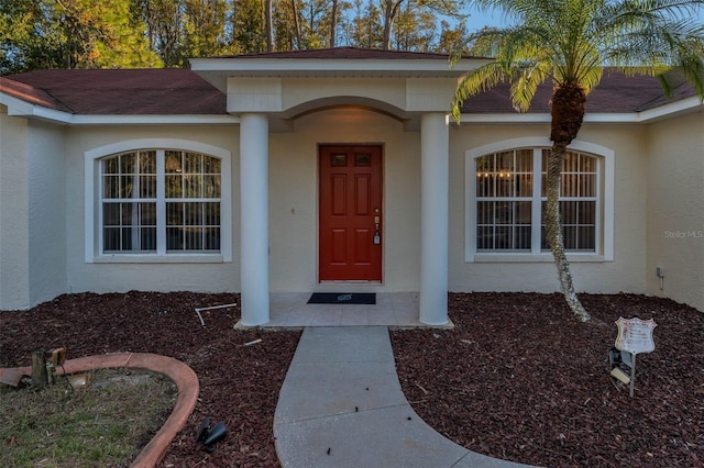 property entrance featuring a porch