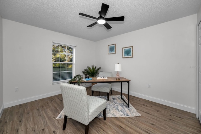 office with ceiling fan, hardwood / wood-style floors, and a textured ceiling