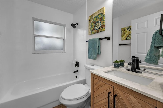 full bathroom featuring vanity, toilet, a textured ceiling, and bathing tub / shower combination