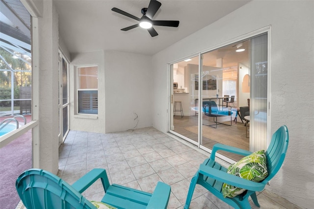 sunroom / solarium with ceiling fan