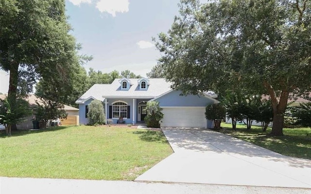 view of front of property with covered porch, a garage, and a front lawn