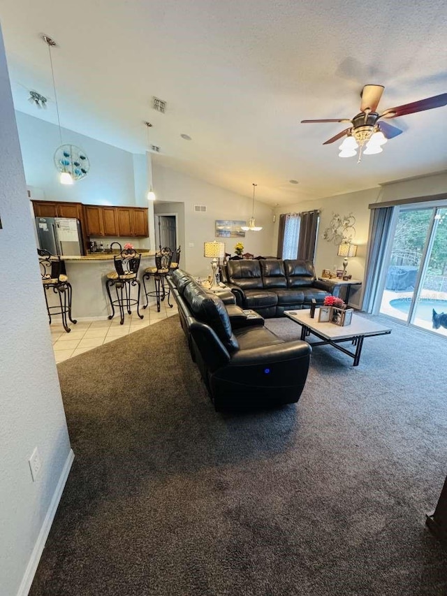 living room with ceiling fan, light carpet, and lofted ceiling