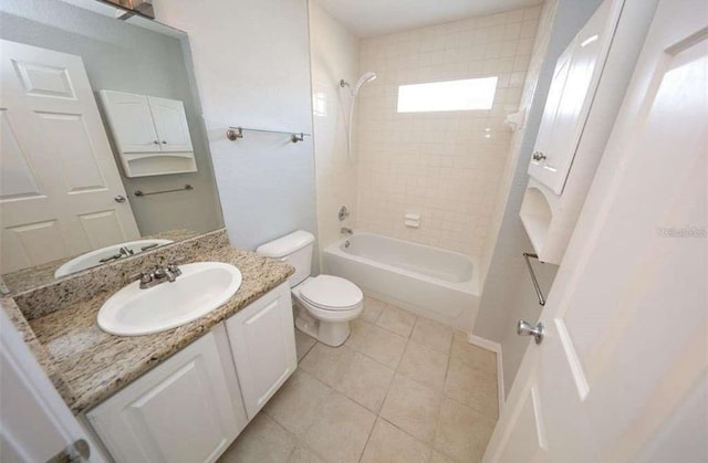 full bathroom featuring tile patterned floors, vanity, toilet, and tiled shower / bath