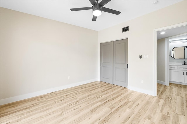 unfurnished bedroom with a closet, ceiling fan, and light hardwood / wood-style flooring