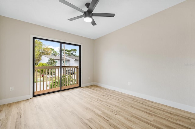 spare room with ceiling fan and light wood-type flooring