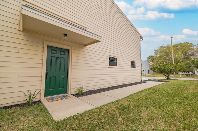 property entrance with a yard