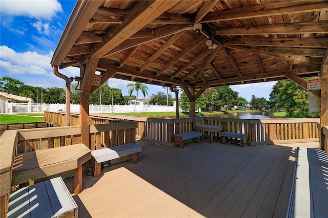 deck featuring a gazebo and a water view