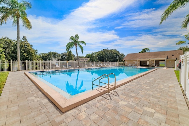 view of pool featuring a patio