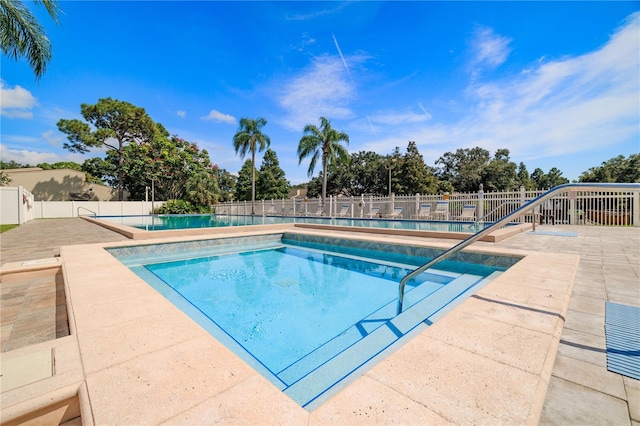 view of swimming pool with a patio