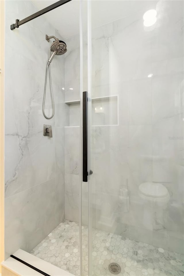 bathroom featuring an enclosed shower