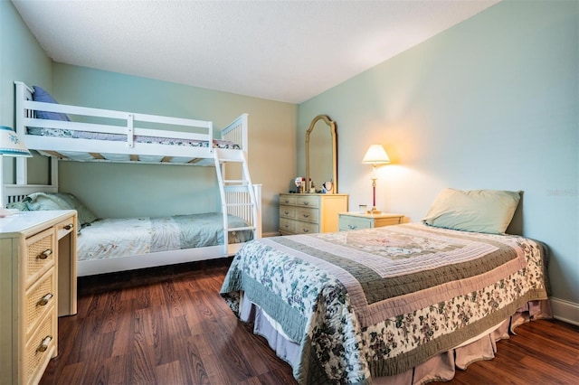 bedroom featuring dark wood-type flooring