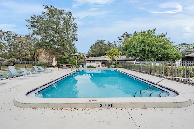 view of swimming pool featuring a patio area