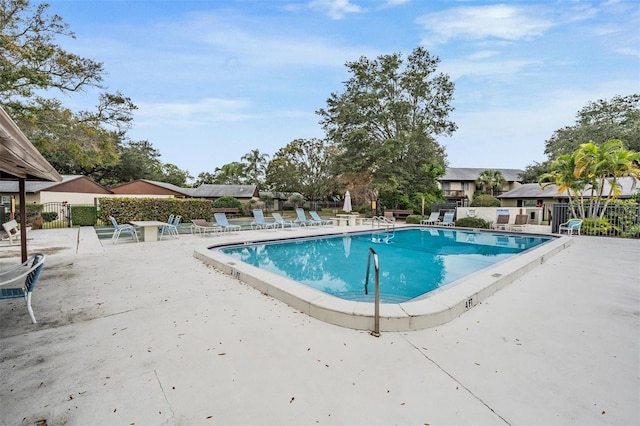 view of swimming pool with a patio