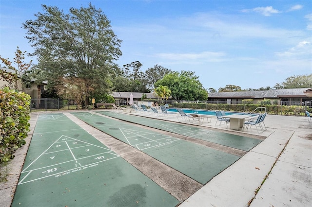 view of home's community featuring a swimming pool