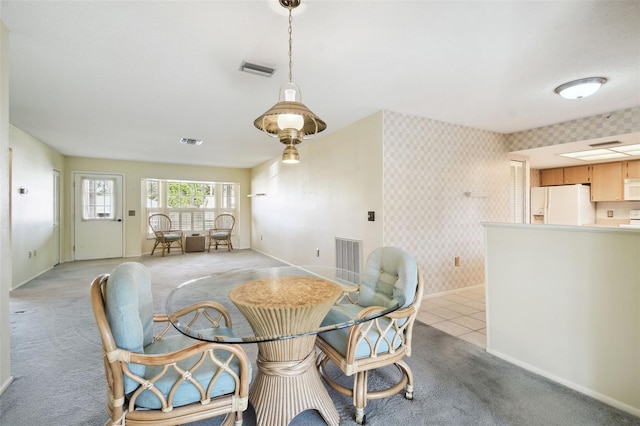 view of carpeted dining area