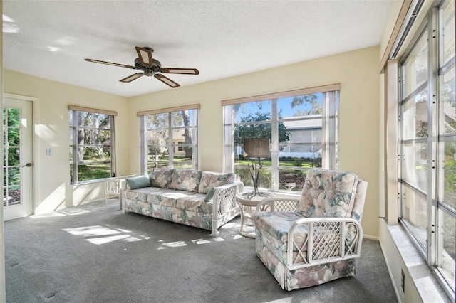 sunroom with ceiling fan