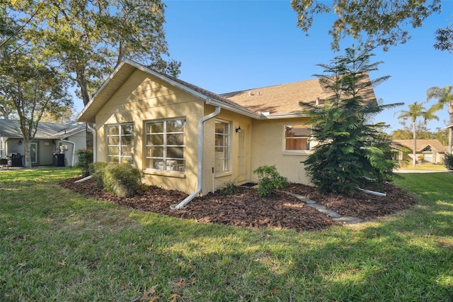 view of home's exterior with a yard