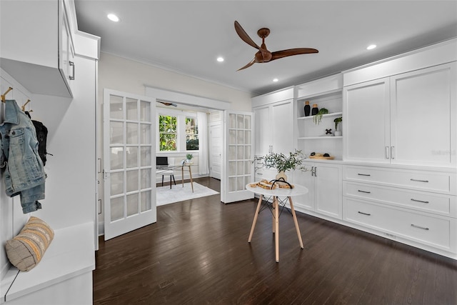 interior space with dark hardwood / wood-style floors, ceiling fan, crown molding, and french doors