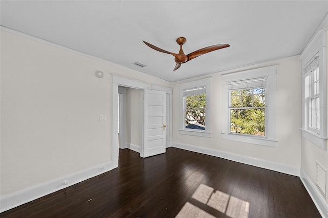 unfurnished room with ceiling fan and dark hardwood / wood-style flooring