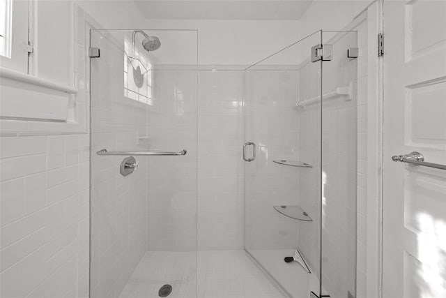 bathroom featuring a healthy amount of sunlight and an enclosed shower