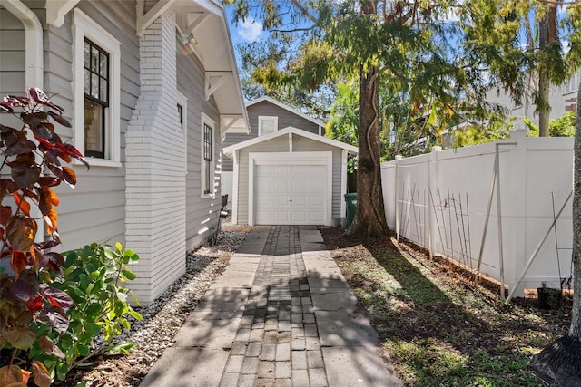 view of side of property with an outdoor structure and a garage