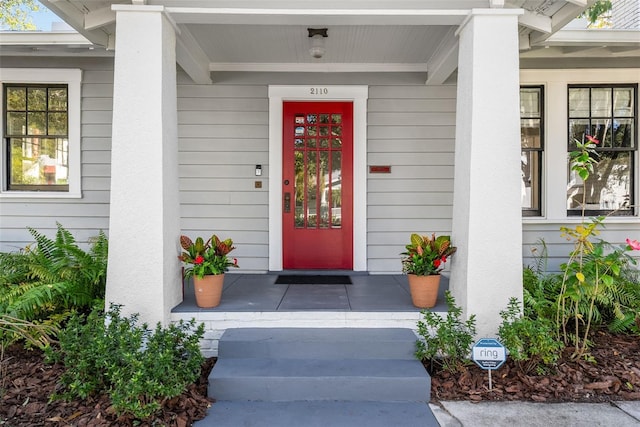 doorway to property with a porch