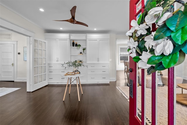 interior space featuring ceiling fan and dark wood-type flooring