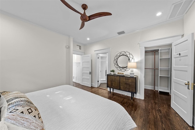 bedroom with ceiling fan, a closet, dark wood-type flooring, and ornamental molding