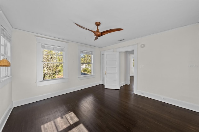 empty room featuring dark hardwood / wood-style floors and ceiling fan