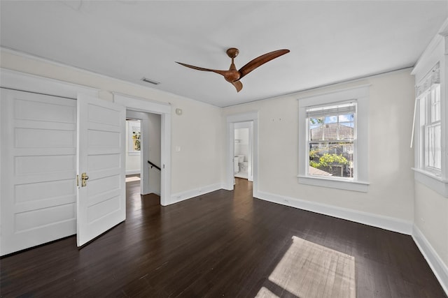 unfurnished room with dark hardwood / wood-style floors and ceiling fan