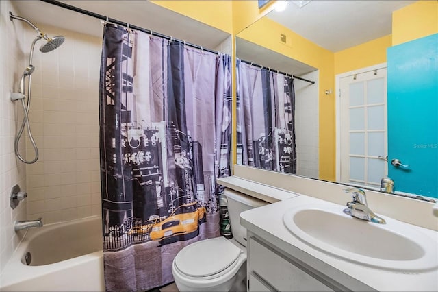 full bathroom featuring vanity, shower / bath combo, and toilet