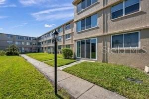 4915 Bay St NE Unit 123, Saint Petersburg, FL 33703 - view of property's community featuring a lawn