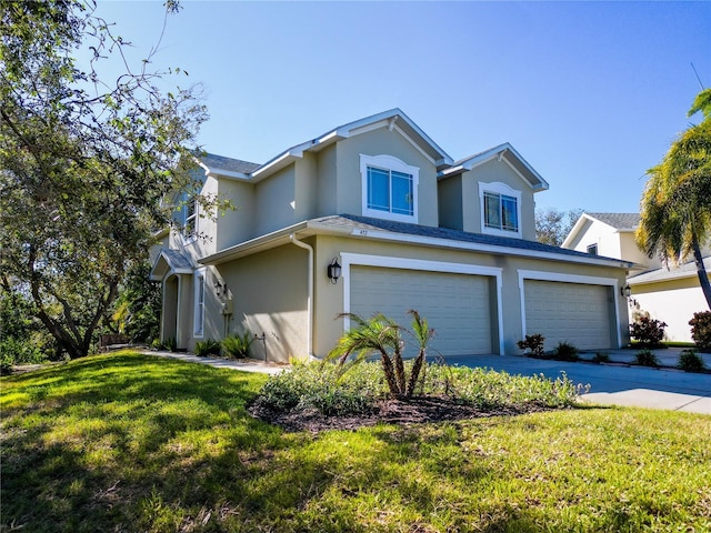 view of front property with a garage and a front lawn