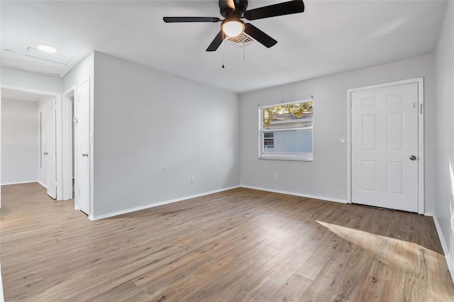 spare room with ceiling fan and light hardwood / wood-style flooring