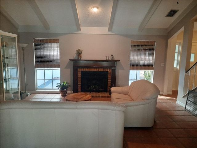 tiled living room with a fireplace