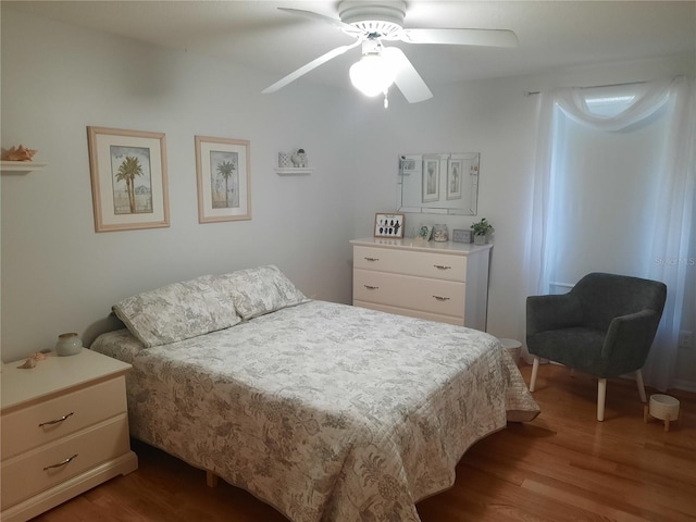 bedroom featuring ceiling fan and light hardwood / wood-style flooring