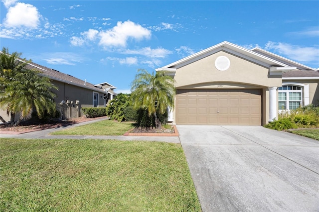 view of front of house with a garage and a front lawn