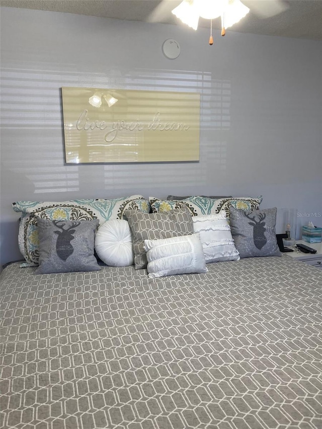 bedroom featuring ceiling fan and carpet flooring