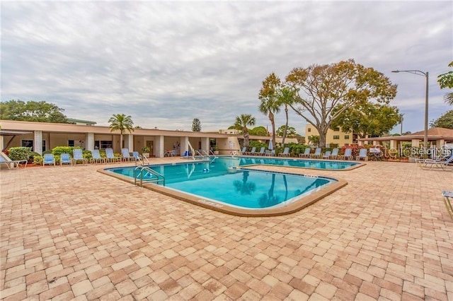 view of swimming pool featuring a patio area