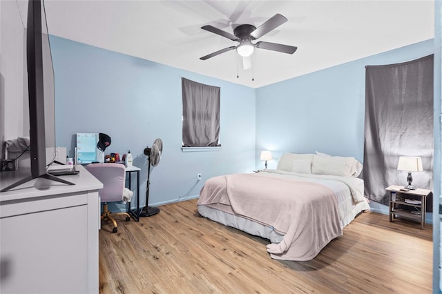 bedroom featuring ceiling fan and light hardwood / wood-style flooring